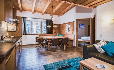 Apartments & Panorama Restaurant Margarethenstein Kitchen and lounge area in apartment Type C, with private sauna in the Margarethenstein