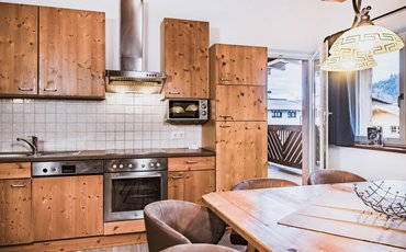 Kitchen and lounge area in apartment Type C, with private sauna in the Margarethenstein