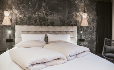 Panorama Restaurant Hotel Margarethenstein gemütliches Bett in der Auszeit Suite im Design Hotel Margarethenstein